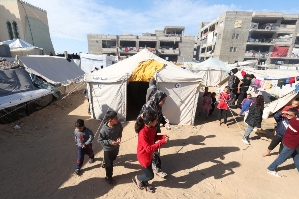 Narrow and packed with patients, volunteers' medical tent tends to displaced Gazans